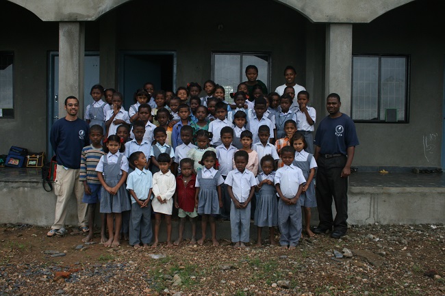 Gavin with the students and teacher of the A-I (Siddi) Light Academy. India, 2007.