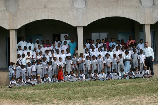 Gavin with the students and teacher of the A-I (Siddi) Light Academy. India, 2008.