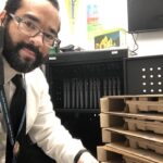 Gavin prepping a school laptop cart.