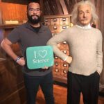 Gavin standing next to a wax figure of Einstein.