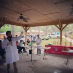 Gavin presenting at an outdoor school science fair.